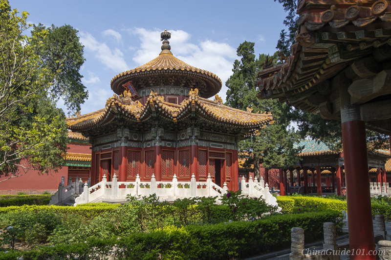 The Pavilion of Myriad Springs inside the Imperial Garden at the Palace Museum, Beijing, highlighting its unique traditional Chinese round-and-square roof and lush green garden surroundings.