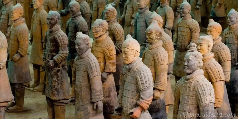 Rows of ancient Chinese terracotta warrior statues standing in a pit at the Terracotta Army museum in Xi'an