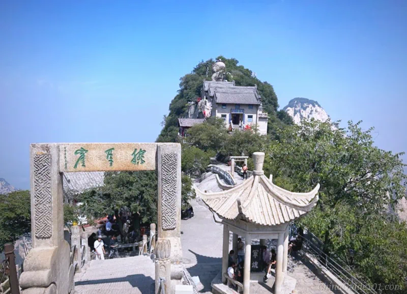 Stone archway and pavilion with Huashan North Peak (Cloud Terrace Peak) in the background