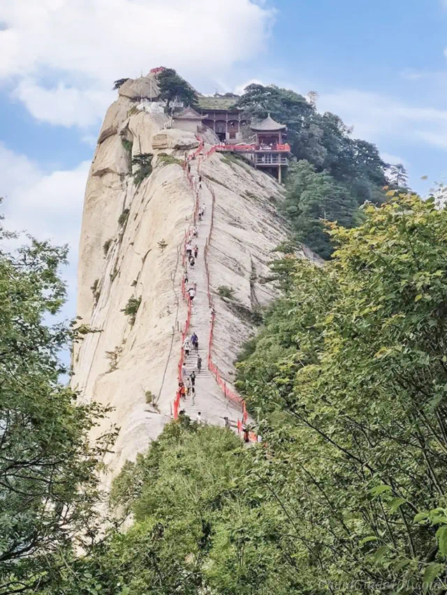 Long steep stone trail climbing up Huashan West Peak (Lotus Peak), with Cuiyun Palace on the summit