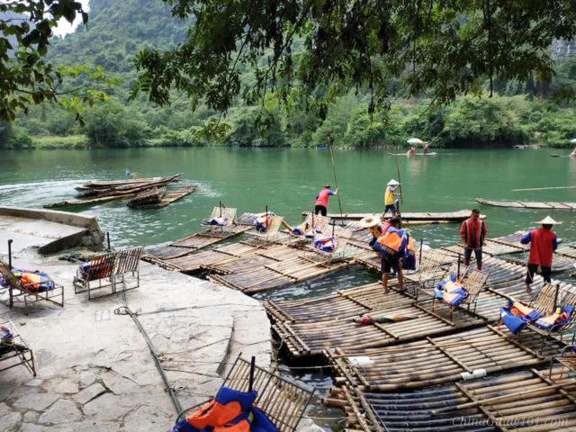 Shuiedi Dock on Yulong River, bamboo rafts and boatmen preparing for raft trips, Yangshuo